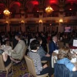 Attendees seated in the ballroom.