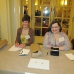 Two BCIL staff members at the registration table.