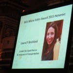 Projector screen displays photo of honoree award winner.