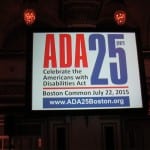 A sign for the ADA 25 Celebration on a projector screen.
